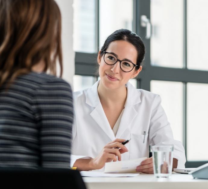 Woman at consultation with dental team member