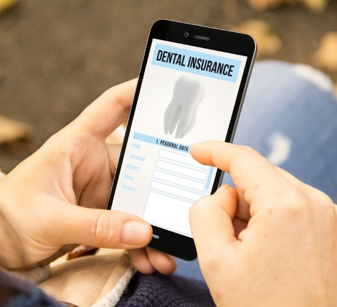 Person looking at dental insurance information on their phone