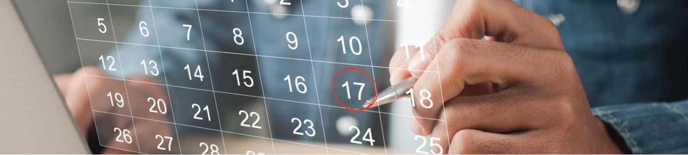 Person circling date of oral surgery appointment on calendar